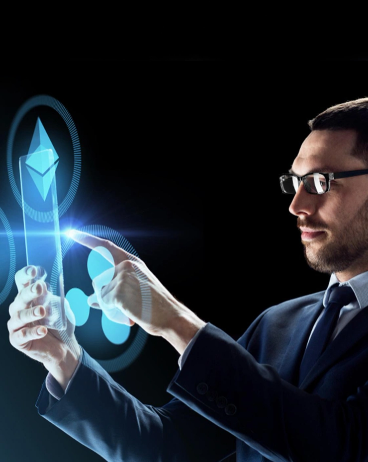 A professional uses a transparent smartphone to interact with cryptocurrency icons like Ethereum